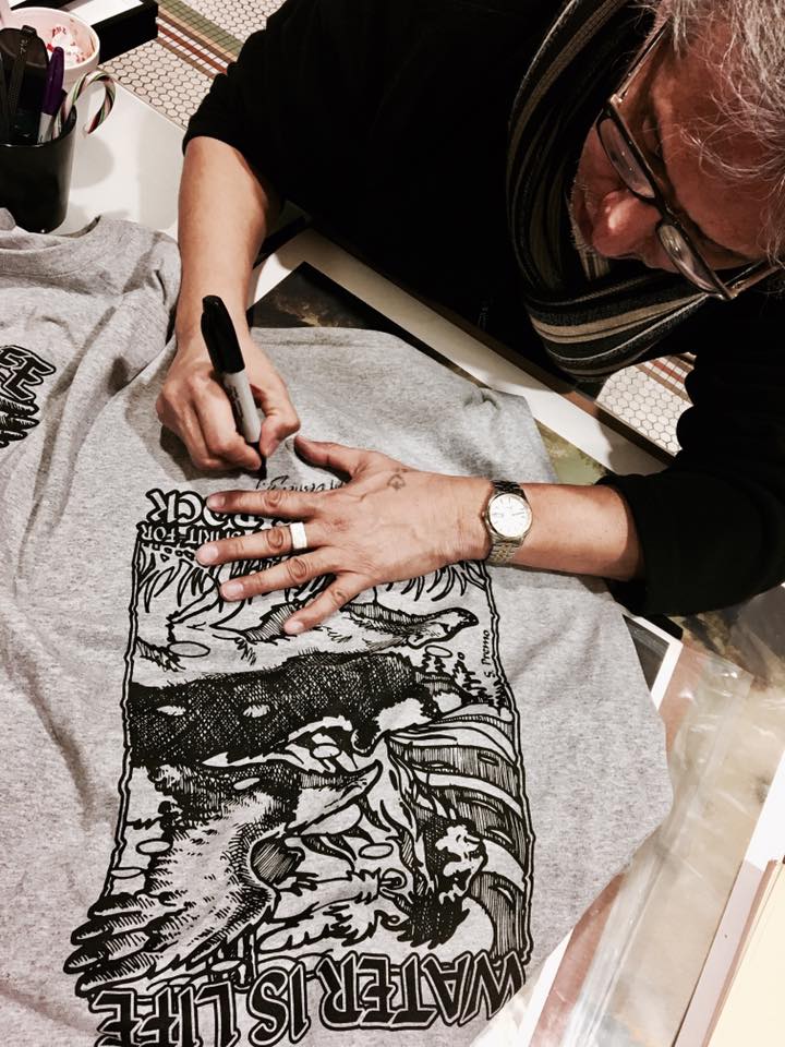 Steve Premo signs T-shirts